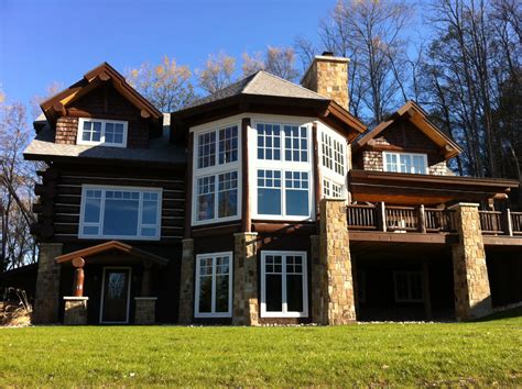 After a day on the slopes, relax in the hot tub or in front of the stone fireplace. Handcrafted Log Cabin Lodge - Boyne Mtn | Timber Wolf ...