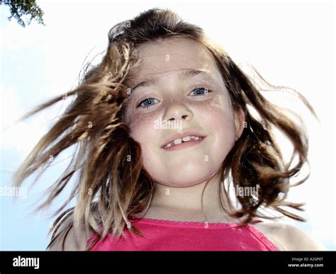 Portrait Of A Girl Looking Down Onto A Camera Lens Stock Photo Alamy