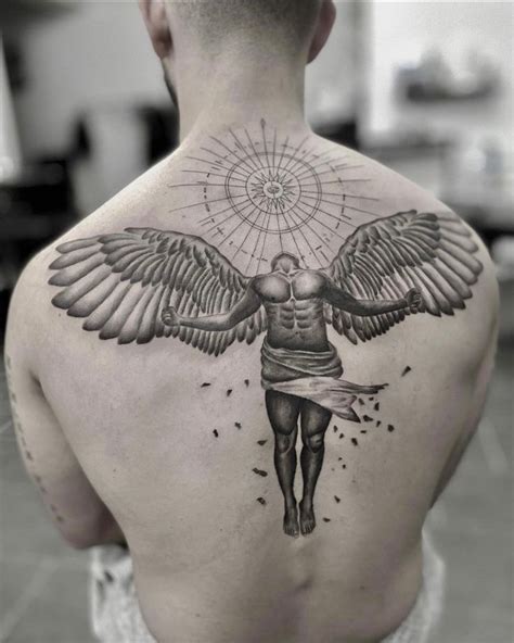 A Man S Back With An Angel Tattoo On It