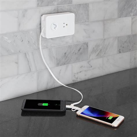 The Smartphone Cord Retracting Charging Outlet Hammacher Schlemmer