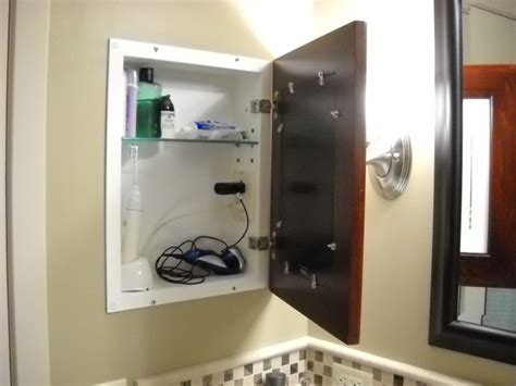 There is a power box within the cabinet that accepts the feed for the lighting and the electrical outlet within the box. Recessed Picture Frame Medicine Cabinets with No Mirrors ...