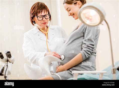 pregnant woman patient with a senior gynecologist during the consultation in the gynecological
