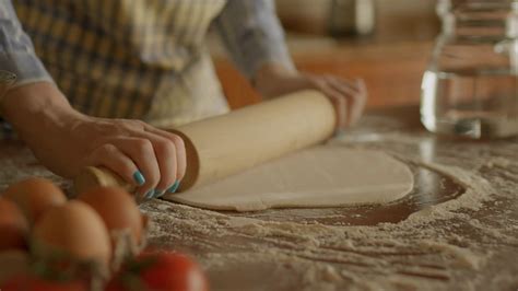 Young Adult Woman Rolling Dough Standing In The Kitchen Female Chef In
