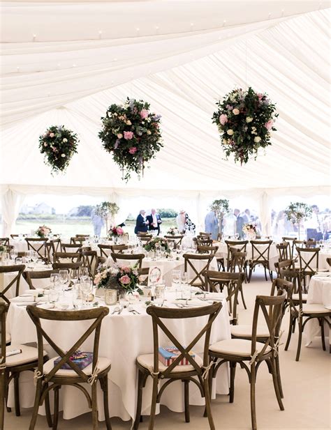 hanging flowers look fab in the high ceiling of a wedding marquee marquee wedding decoration