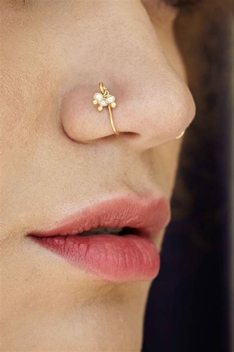 15 beautiful nose pins you can try that don t even require a piercing