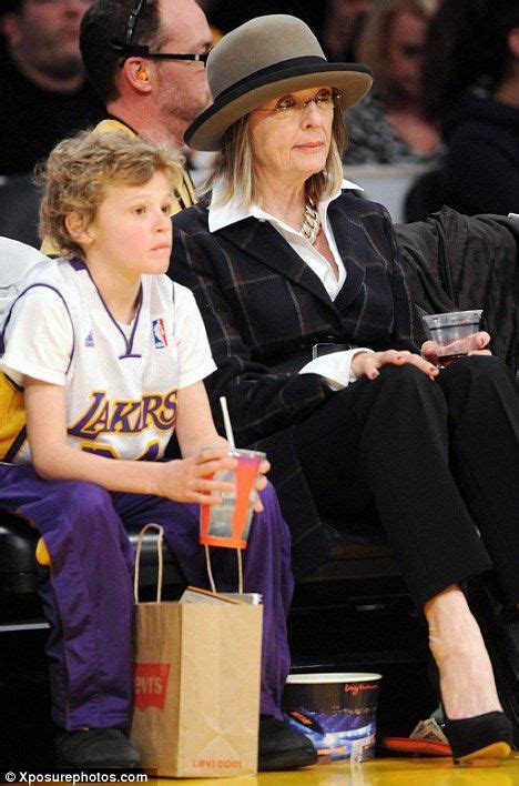 my man diane is seen here with her adoptive son duke at a basketball game in january this year