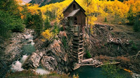 Abandoned Old Wooden Mill Near River Cliff Crystal