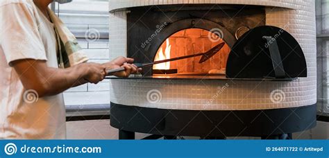 Chef Baking Neapolitan Pizza In A Gas Fired Classic Italian Pizza Oven