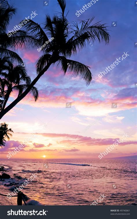 A Colorful Tropical Sunset At Kaanapali Beach In Maui With