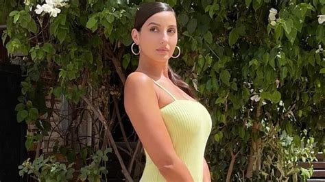 Nora Fatehi Pairs Sexy Neon Yellow Bodycon Dress With Lakh Bag For Shoot TechiLive In