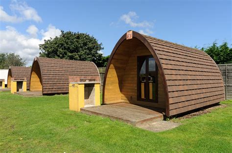 Glamping tents are often elevated from the ground on platforms. North Shore Glamping Pods - Coastfields