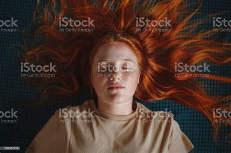 Young Freckled Redhead Woman Lying Down Eyes Closed Flat Lay Concept