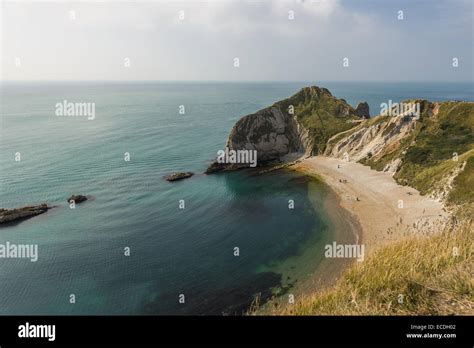 Durdle Door Is A Natural Limestone Arch On The Jurassic Coast Near