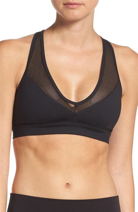 Clean, classic and built for performance this bra is a hybrid of function and style that will take you through any work out. Alo Yoga Entice Sports Bra In Black | ModeSens
