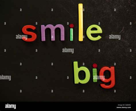 Smile Inspirational Message In Vibrant Colorful Magnet Letters Stock