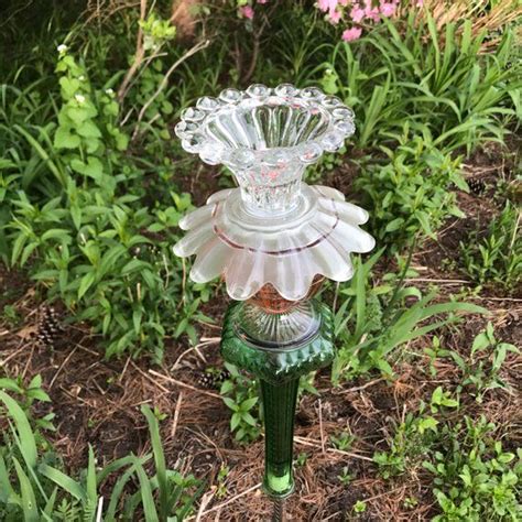 There is a spoon attached to the back that inserts into a pole, which to save you money on shipping cost, can be purchased at any hardware. Repurposed Glass Flower/Suncatcher | Etsy | Glass flowers ...