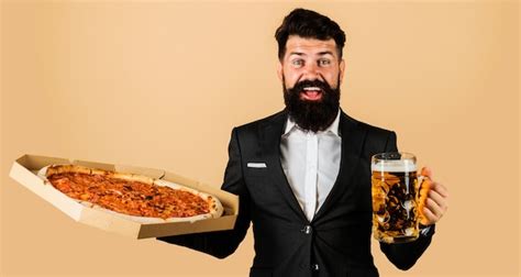 Premium Photo Restaurant Or Pizzeria Smiling Man With Pizza And Beer