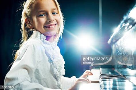 Girl Playing Piano On Stage Photos And Premium High Res Pictures