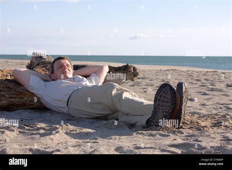 Man Sleeping On Beach Stock Photo Alamy