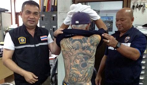 fugitive from japanese yakuza gang is given away by tattoos after 14 years on the run extra ie