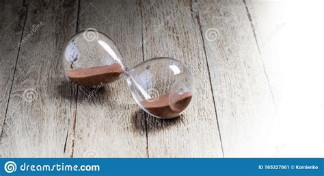 Glass Hourglass Lying On Wooden Stock Image Image Of Measurement