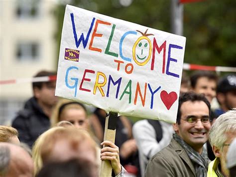 In Pics Syrian Refugees Arrive In Germany To Welcome Signs World