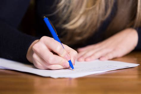 Female Hand Writing On Paper Stock Photo Download Image Now Istock