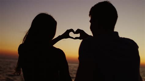 Stock Video Clip Of Romantic Couple Making Heart With Their Hands