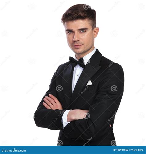 Portrait Of Handsome Elegant Man Standing With Hands Folded Stock Image