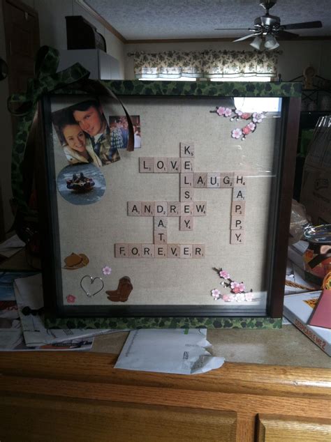 a framed crossword puzzle is displayed on a table with other items and