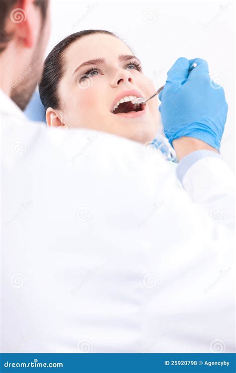 Dentist In Medical Gloves Examines The Oral Cavity Stock Photo Image