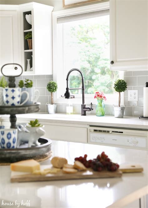 Most modern farmhouse kitchens tend to feature pendant lights above the island workspace, and this setup by sarah bartholomew is no exception. A Modern Farmhouse Kitchen Makeover - House by Hoff