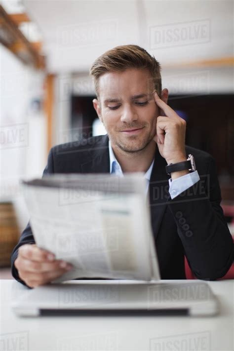Businessman Reading Newspaper Stock Photo Dissolve