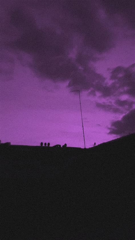 The Sky Is Purple And Dark With Clouds