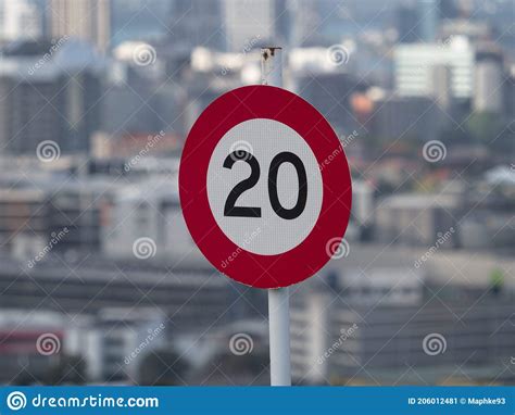 20 Twenty Kilometer Per Hour Kph Speed Limit Traffic Sign In Front Of