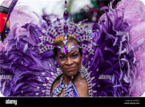 Beautiful Afro Caribbean Woman In Costume At The Notting Hill Carnival In West London In Purple