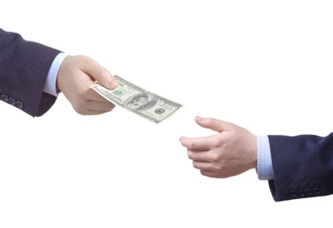 Man Handing Over Money To Another Person Stock Photo Download Image