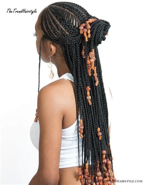 Fulani braids are a braided protective hairstyle that's usually styled with a center braid and one to two pieces braided from back to front at the sides and accessorized with beads. Wrapped Ponytail with In-Front-Of-the-Ear Braids - 20 ...