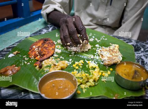 A Man Eats South Indian Meal With His Hand In Mamallapuram India Stock