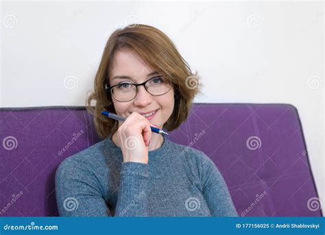 Portrait Of Female Psychologist With Glasses Smiling At Camera The