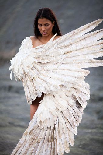 Woman With Wings Standing On The Barren Land Like An Angel From
