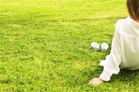 Female Bare Feet On Mawed Lawn Grass Young Woman Resting Outdoors Barefoot Take A Break