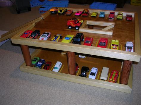 Our acorn wooden toy garage is ideal for young boys and it includes a car wash, petrol pumps, working lift, a car service area and it even includes 5 brightly. hotwheels garage! can't wait till I get the stuff to make this for Andy!