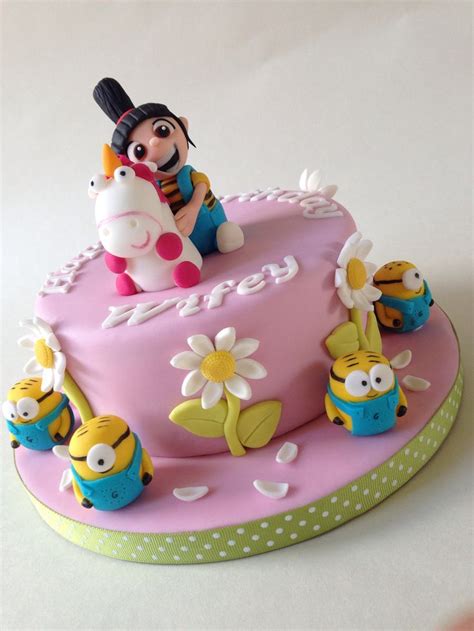 The cake consists of a giant minion peering down at a the cake consists of a giant minion peering down at a cupcake and licking his cartoon lips. Pin by Beatriz Bernard on Despicable Me Party Ideas ...