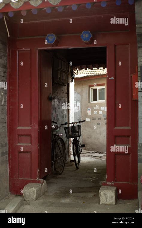 A View Of An Entrance Of A Courtyard In A Traditional Beijing Hutong In