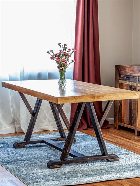 Outdoor farmhouse table from the navage patch How To Build A DIY Dining Table with Angled Trestle Legs