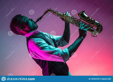 African American Jazz Musician Playing The Saxophone Stock Photo