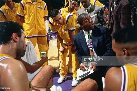 Los Angeles Lakers head coach Magic Johnson talks to his team against