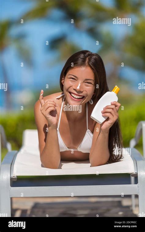 Sunscreen Woman Applying Lotion Putting Cream On Nose Beautiful Smiling Happy Asian Woman With
