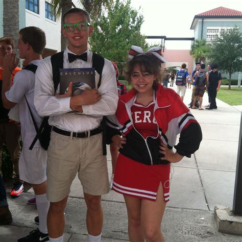 a man and woman dressed in cheerleader outfits standing next to each